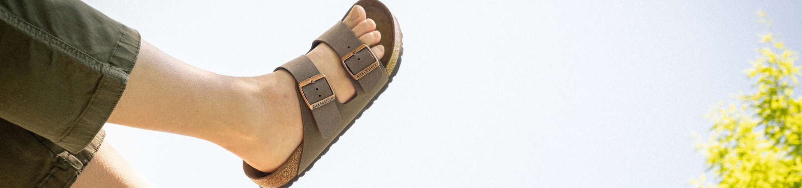 Photos of foot in sandals in the air