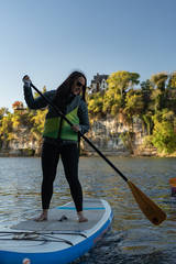Photo of person on standing paddle boat